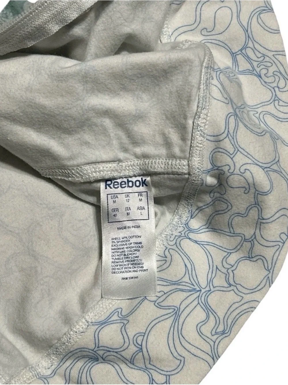 Reebok Women's White Jacket with Light Blue Floral Outline